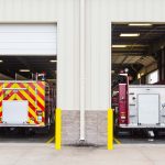 two different types of fire apparatus in their garage Jon's Mid-America Fire Apparatus