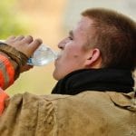 firefighter drinking water to avoid heat exhaustion Jon's Mid-America Fire Apparatus